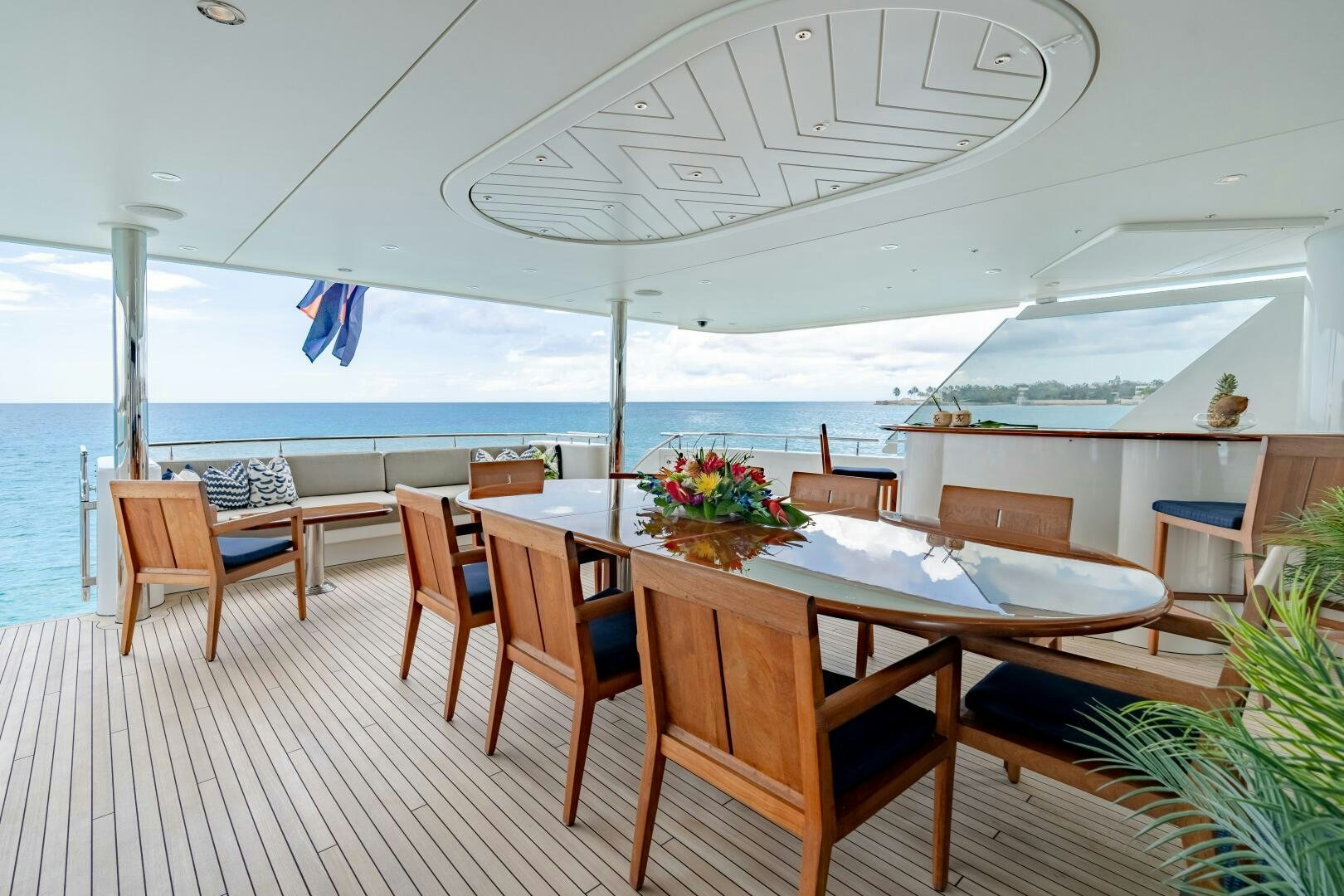 a room with tables and chairs aboard FAR NIENTE Yacht for Sale