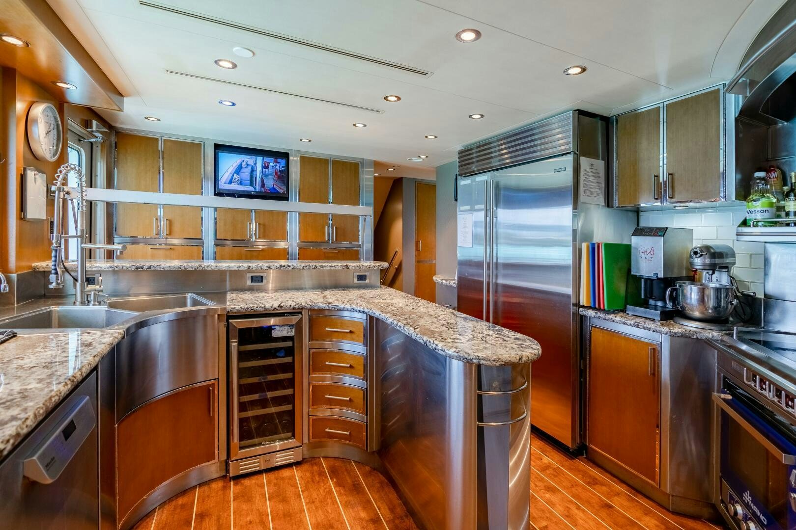 a kitchen with stainless steel appliances aboard FAR NIENTE Yacht for Sale
