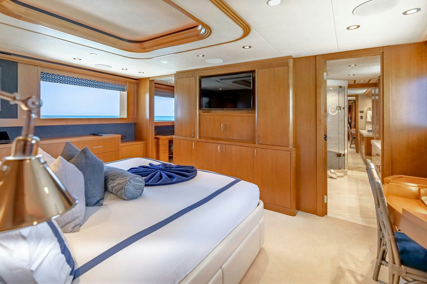 a room with a bed and a wood door aboard FAR NIENTE Yacht for Sale