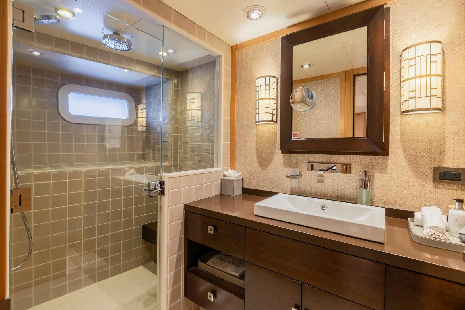 a bathroom with a large mirror aboard ROCHADE Yacht for Sale