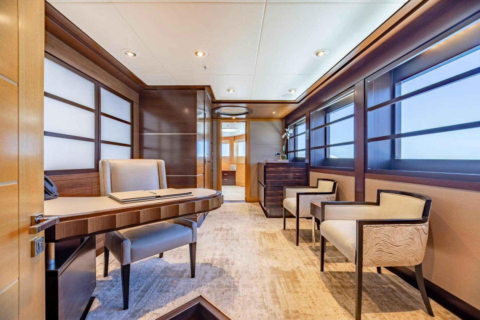a room with a table and chairs aboard ROCHADE Yacht for Sale