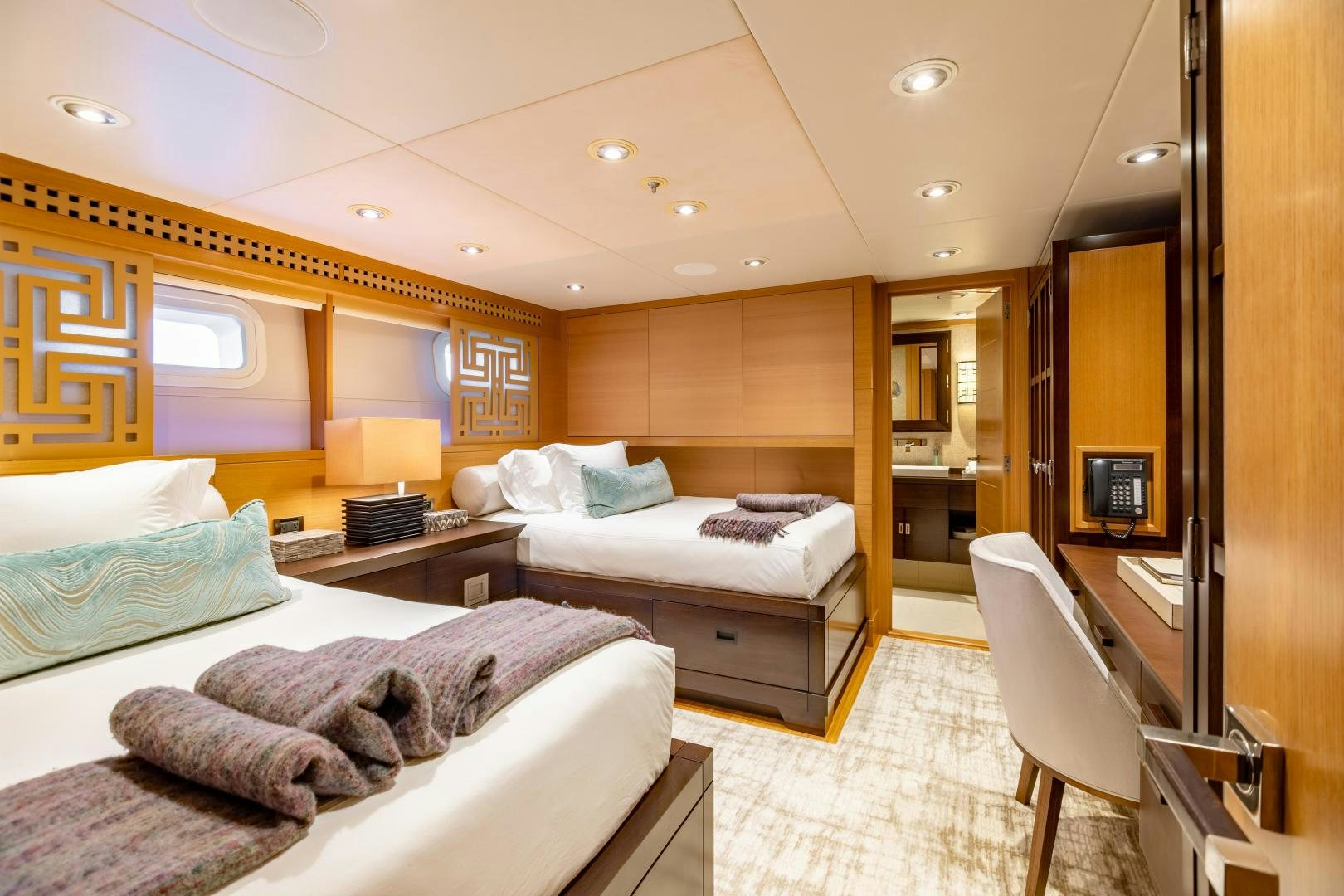 a room with two beds aboard ROCHADE Yacht for Sale