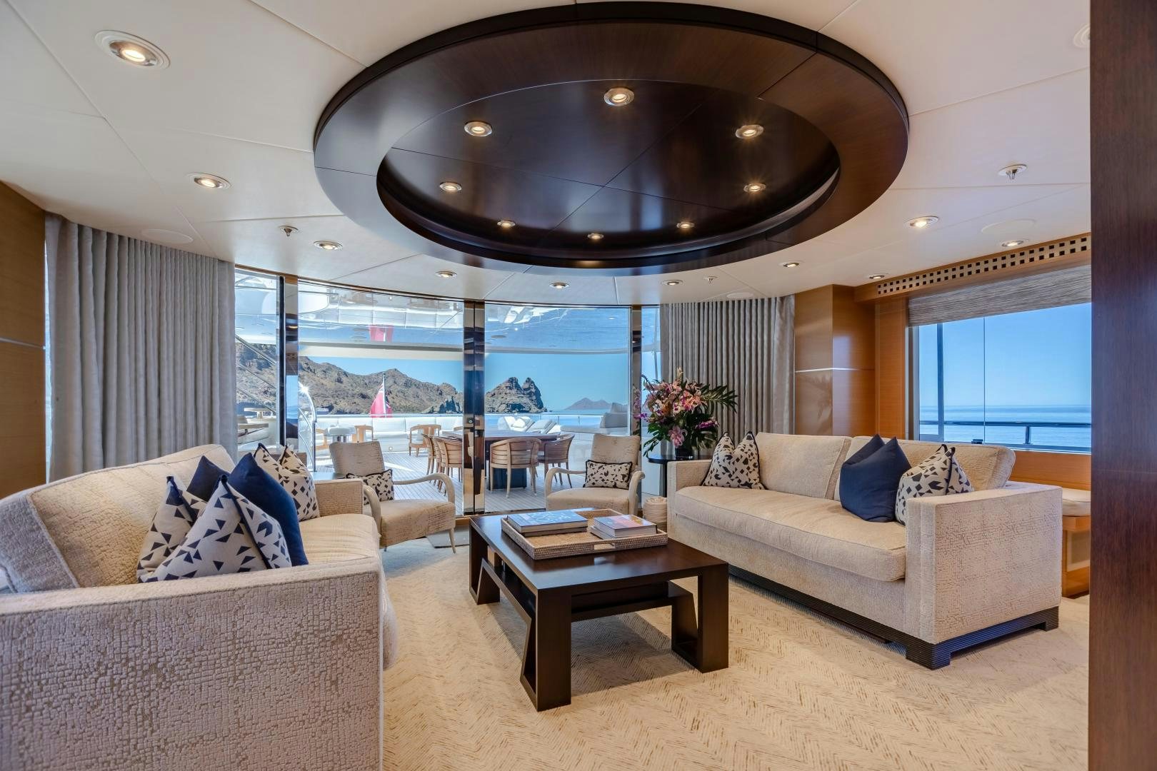 a living room with a large chandelier aboard ROCHADE Yacht for Sale