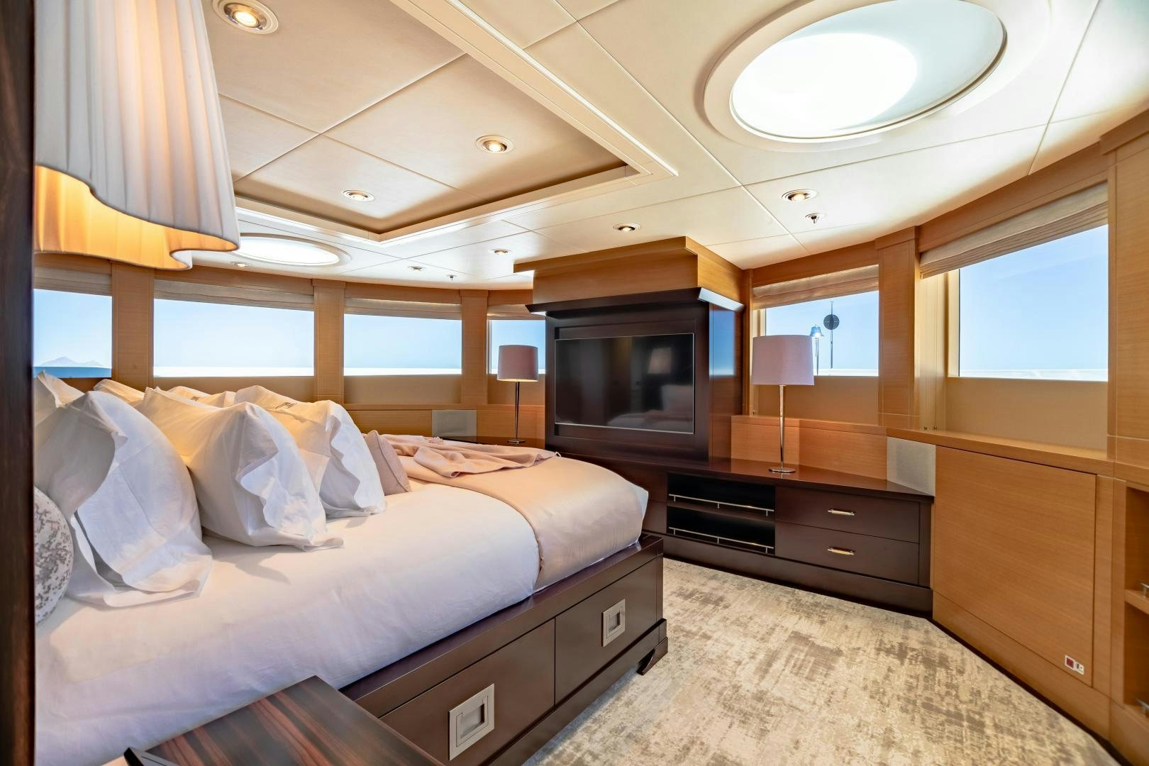 a room with a bed and a television aboard ROCHADE Yacht for Sale