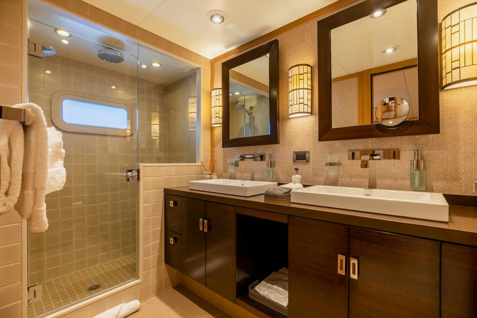 a bathroom with a large mirror aboard ROCHADE Yacht for Sale