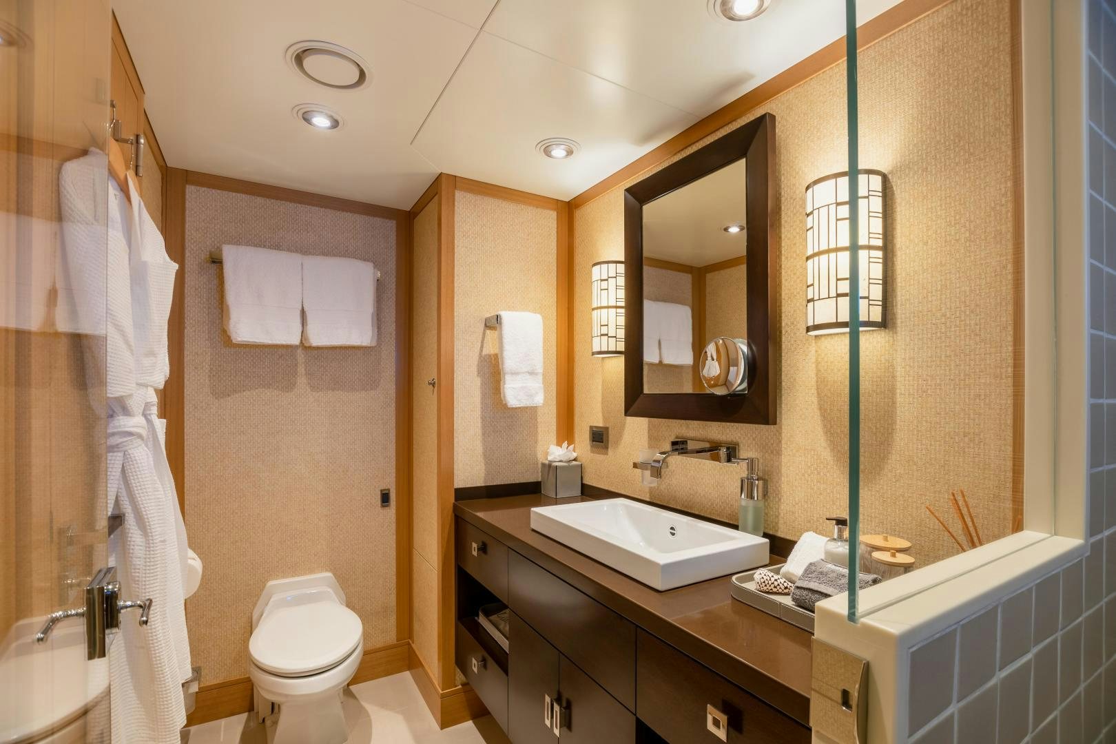 a bathroom with a large mirror aboard ROCHADE Yacht for Sale