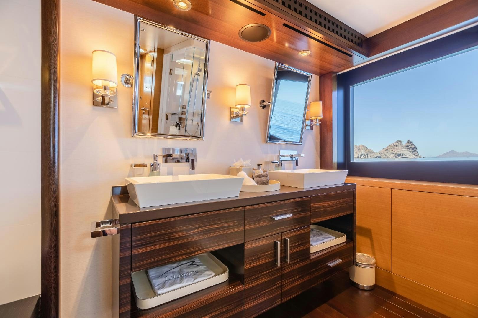 a bathroom with a large mirror aboard ROCHADE Yacht for Sale