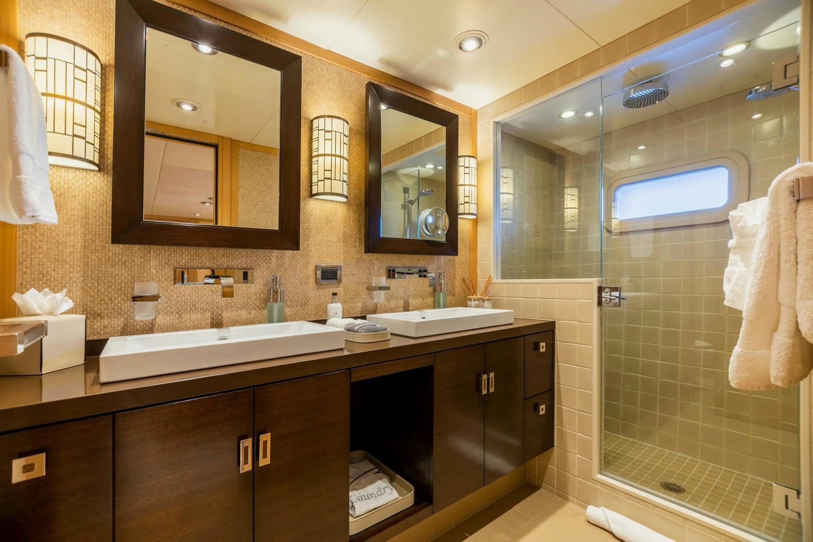 a bathroom with a large mirror aboard ROCHADE Yacht for Sale