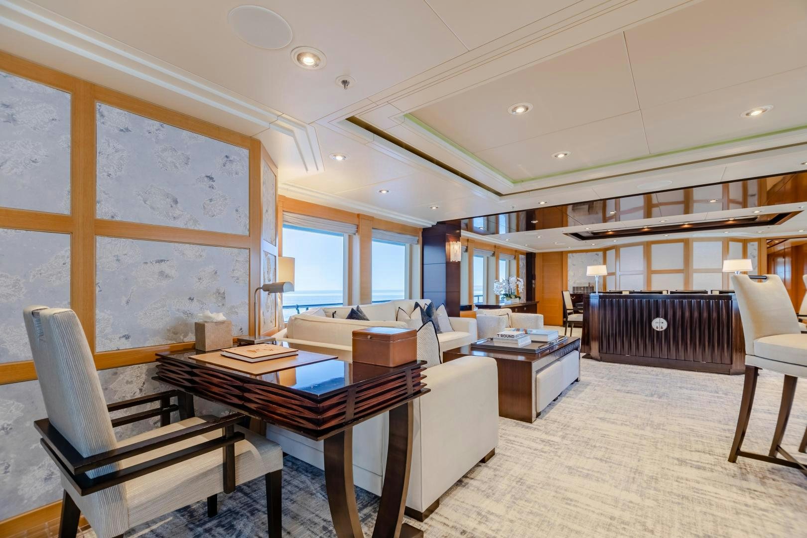 a large room with a table and chairs aboard ROCHADE Yacht for Sale