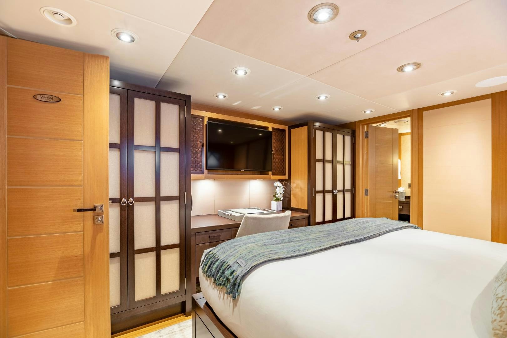 a room with a bed and a door aboard ROCHADE Yacht for Sale