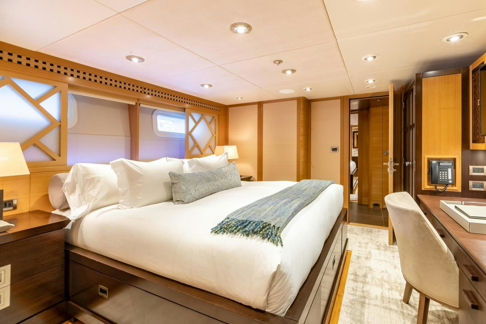 a large bed in a hotel room aboard ROCHADE Yacht for Sale