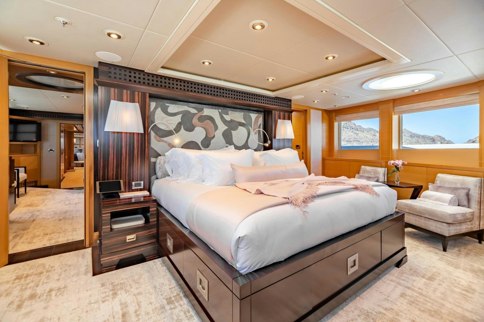 a bedroom with a large bed aboard ROCHADE Yacht for Sale