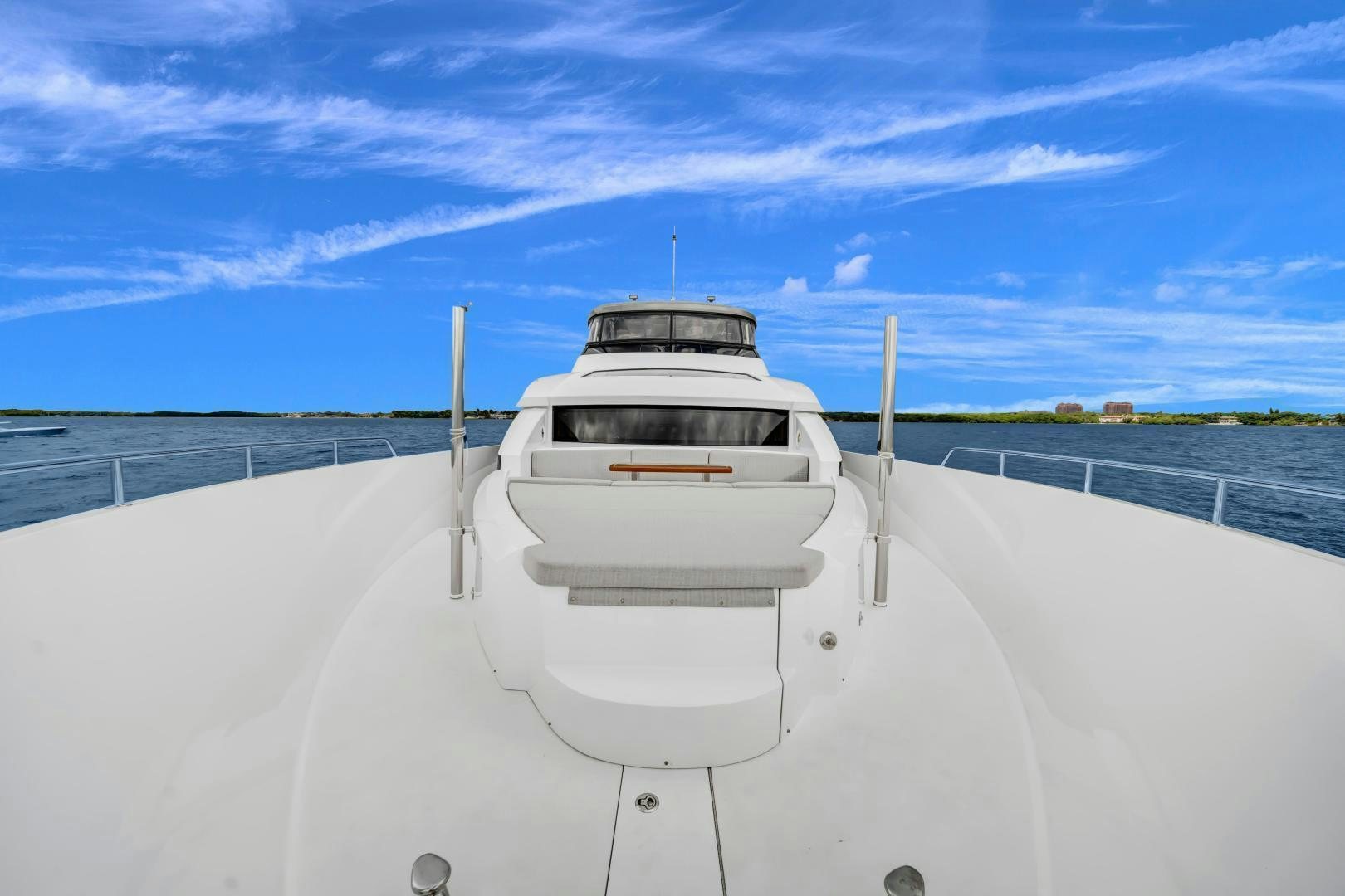 a white car on a snowy road aboard ON Q Yacht for Sale