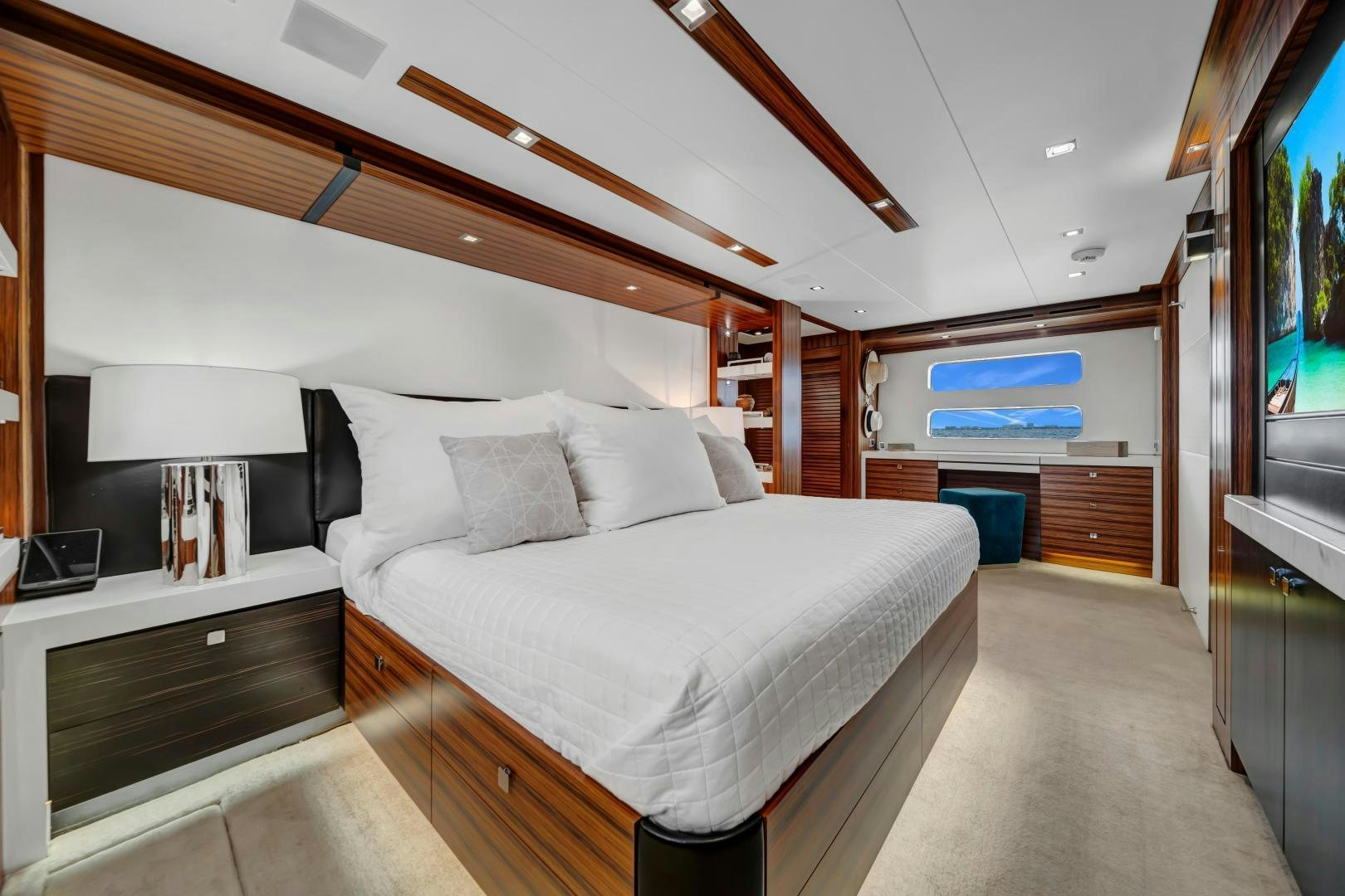 a bedroom with a large bed aboard ON Q Yacht for Sale