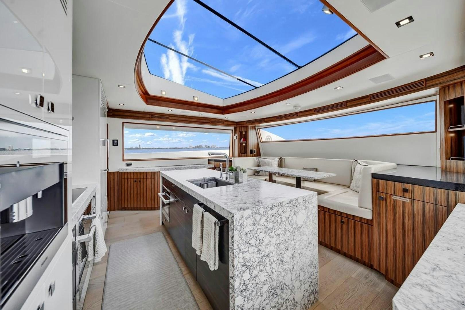 a kitchen with a large window aboard ON Q Yacht for Sale