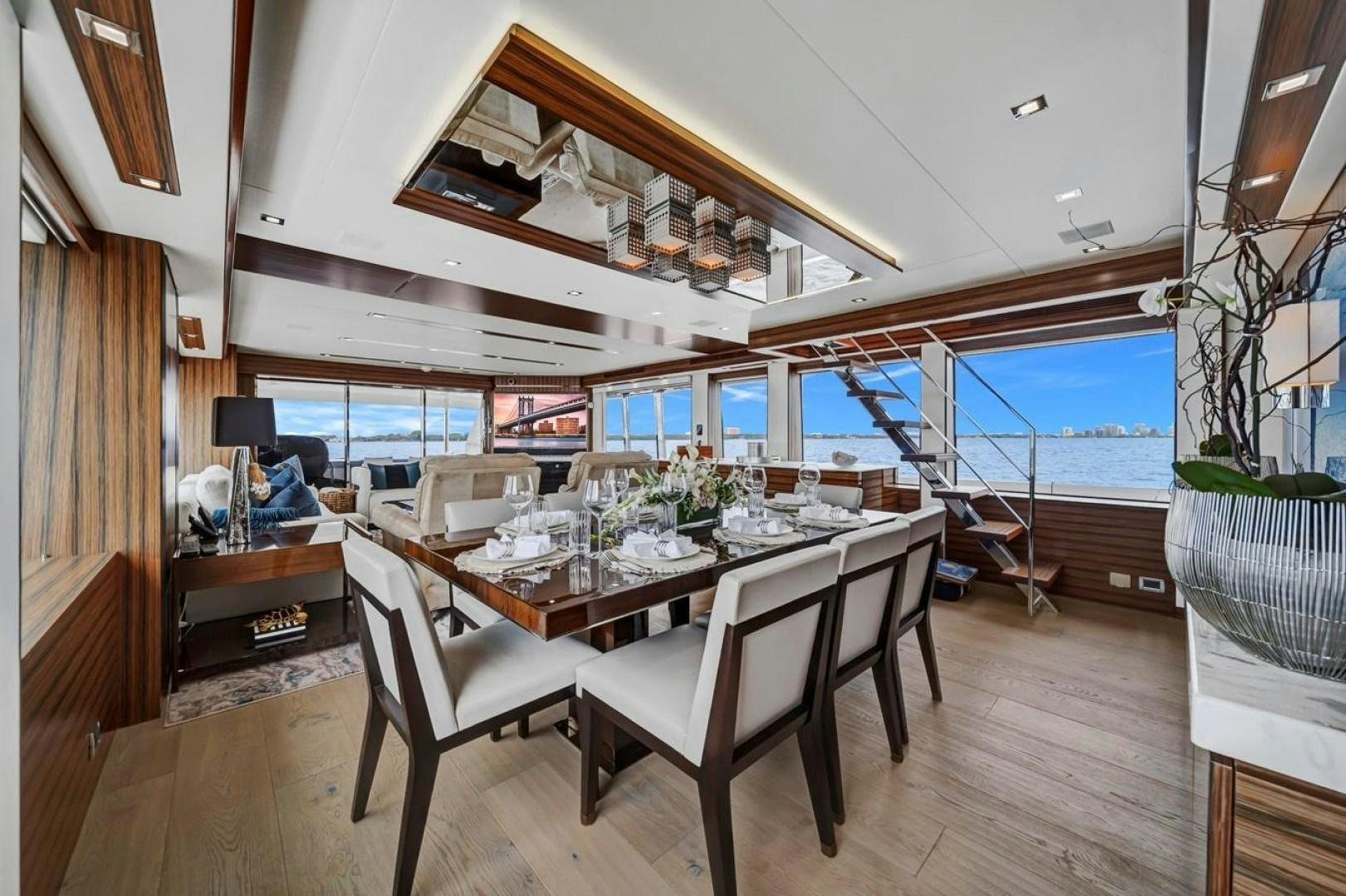 a dining room with a large window aboard ON Q Yacht for Sale