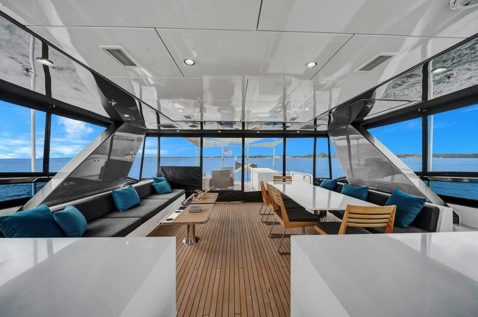 inside of a building with a large window and a wood floor aboard ON Q Yacht for Sale