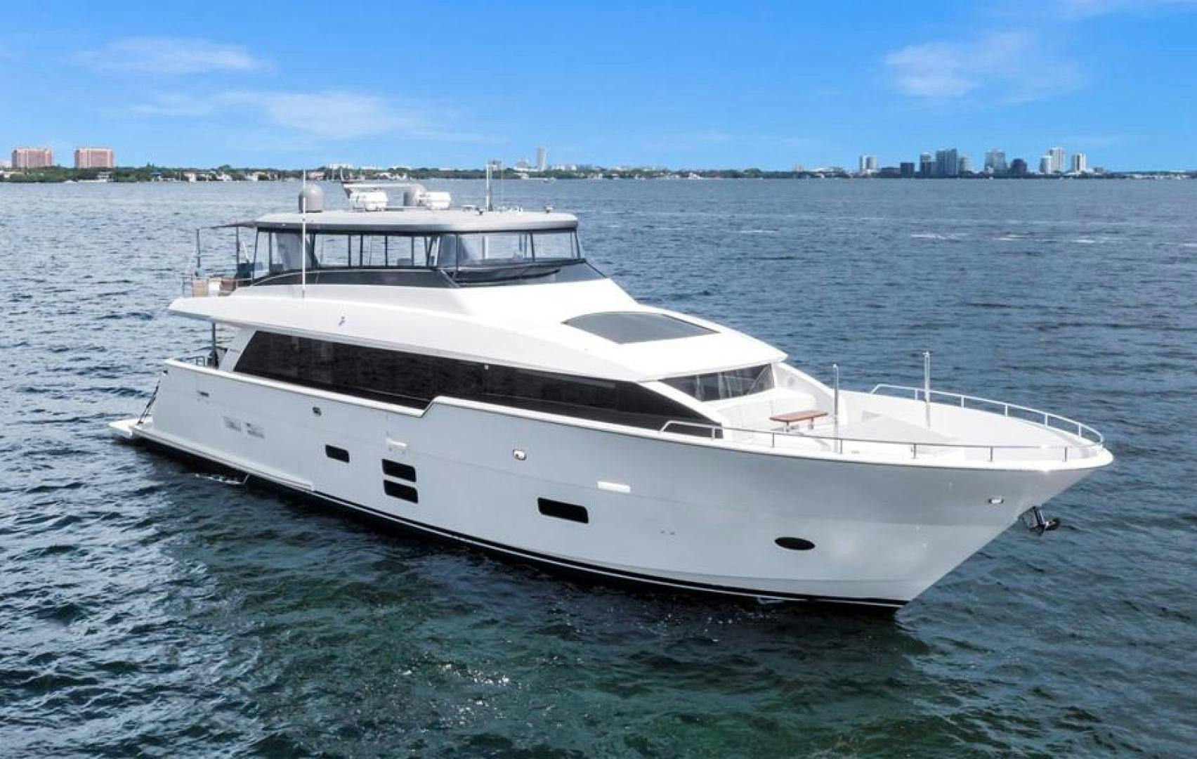 a white yacht on the water aboard ON Q Yacht for Sale