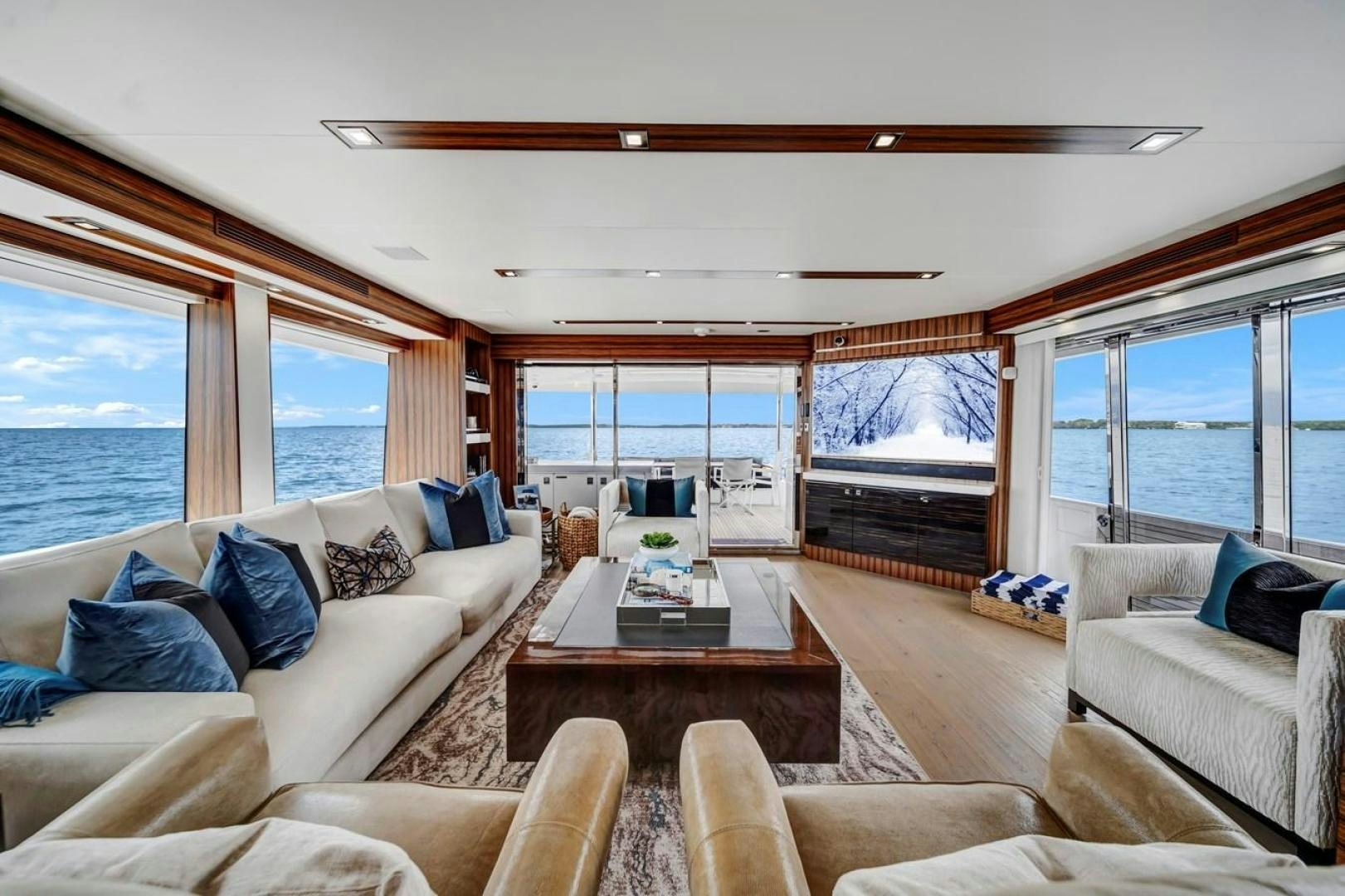 a living room with a large window aboard ON Q Yacht for Sale