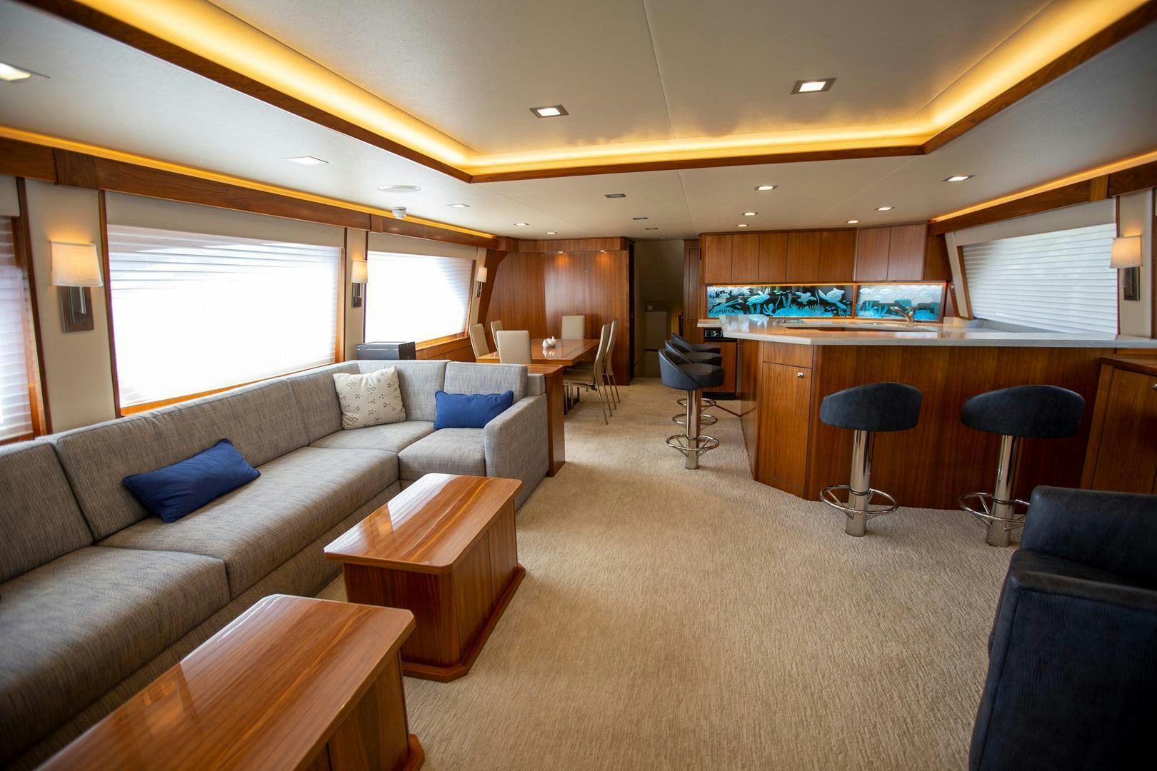 a living room with a couch and a table aboard REEL HIGH'S Yacht for Sale