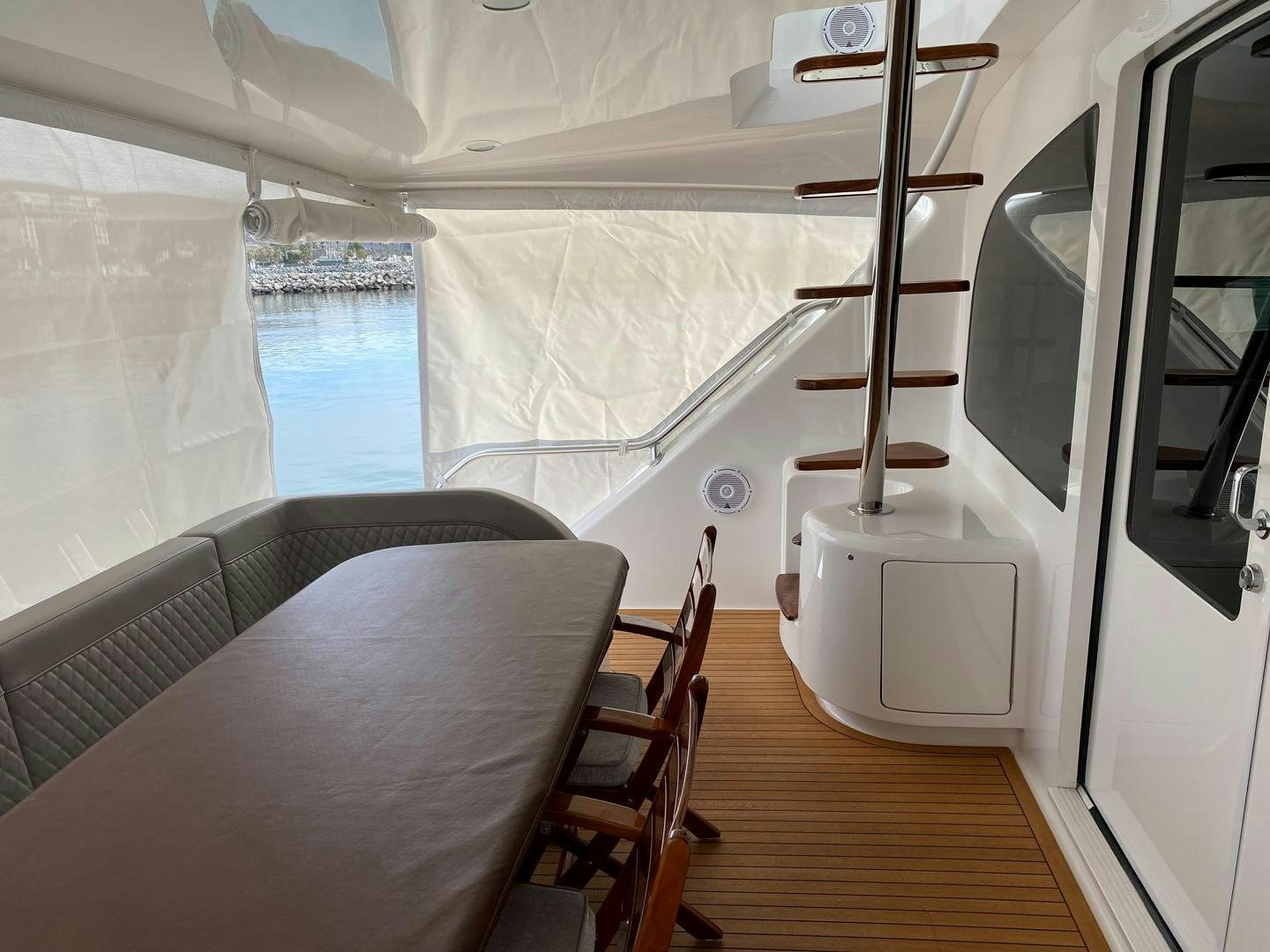 a room with a bed and a chair aboard REEL HIGH'S Yacht for Sale