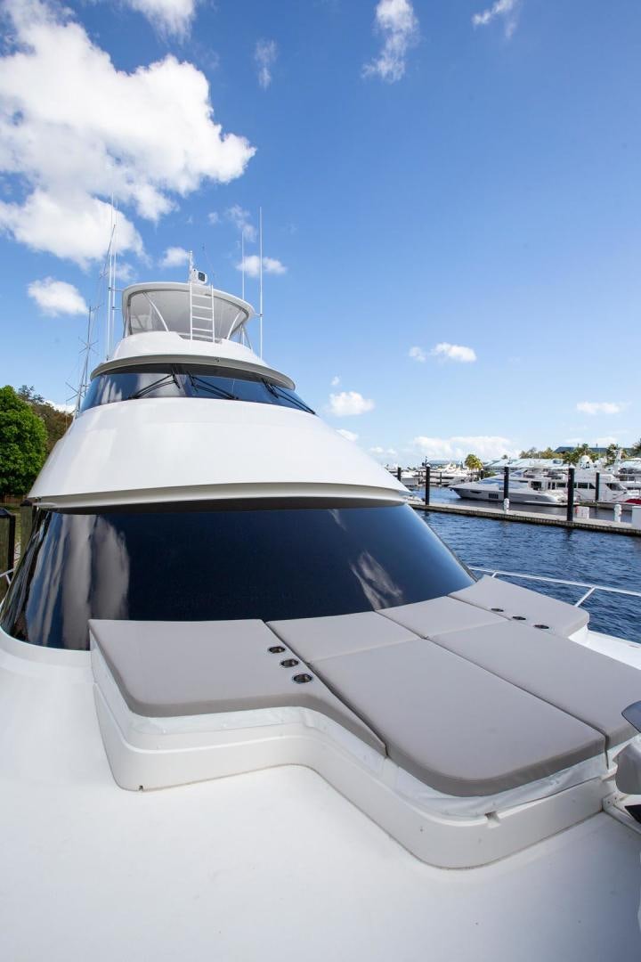 a white boat on a body of water aboard REEL HIGH'S Yacht for Sale