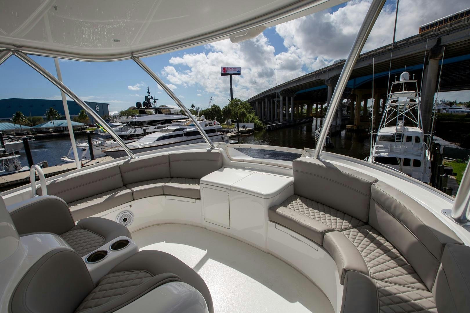 a boat with a deck and chairs aboard REEL HIGH'S Yacht for Sale