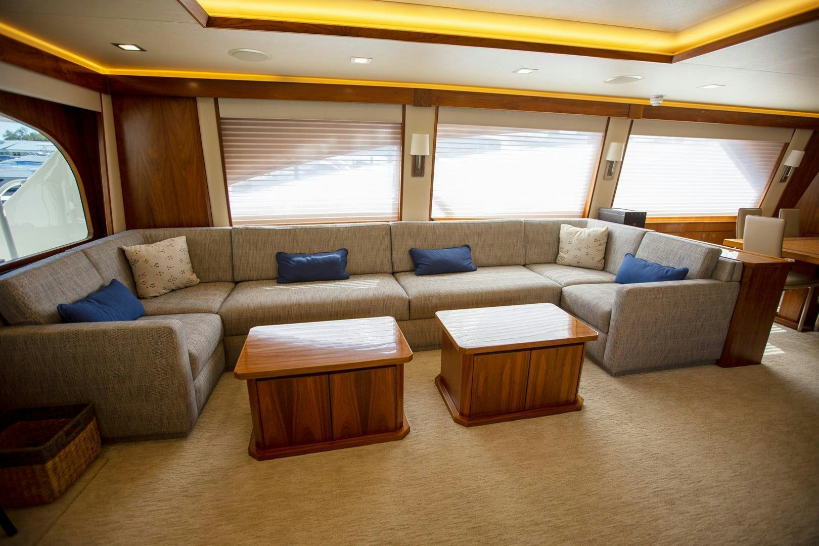 a living room with a couch and a coffee table aboard REEL HIGH'S Yacht for Sale