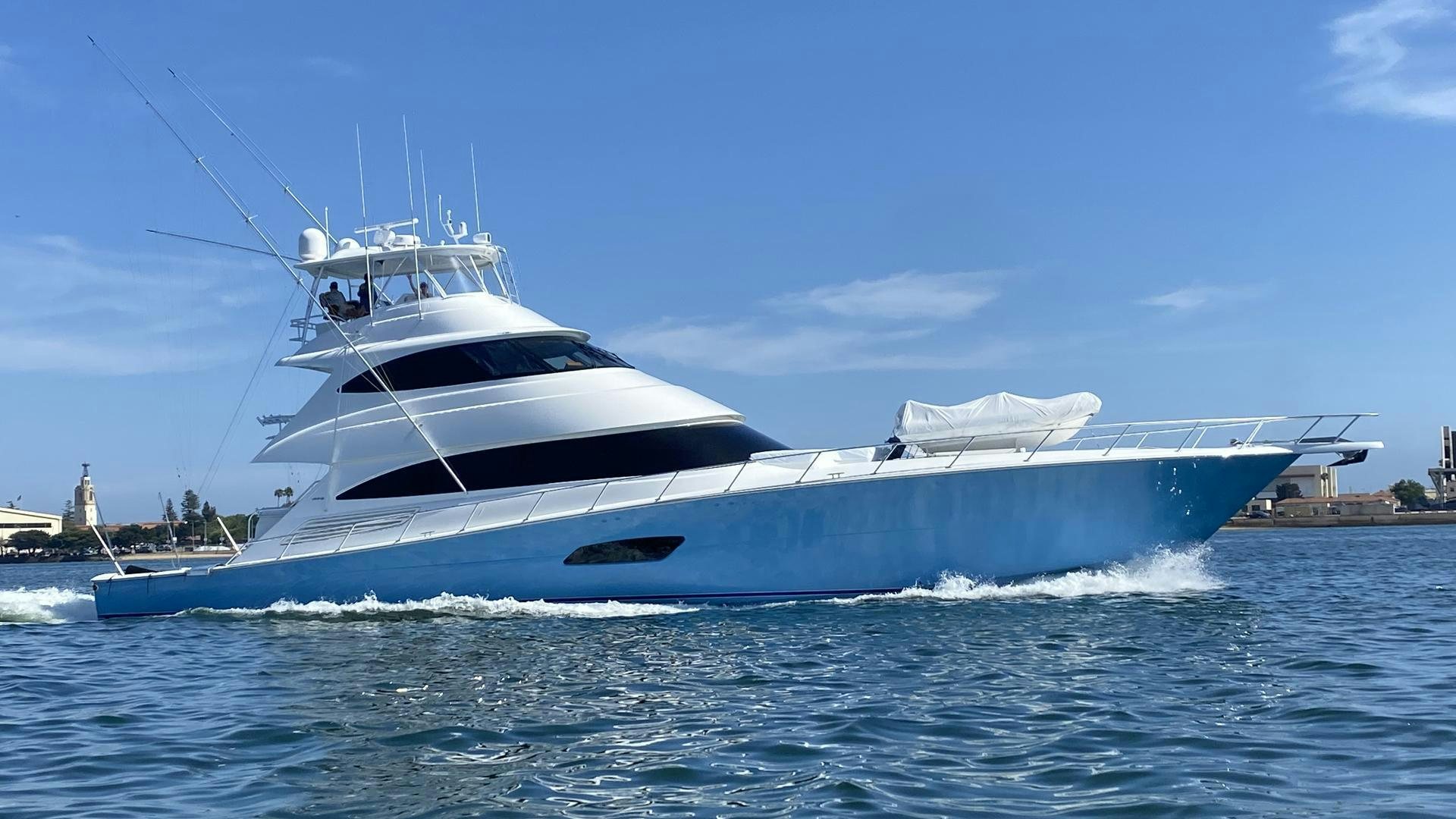 a white yacht on the water aboard REEL HIGH'S Yacht for Sale