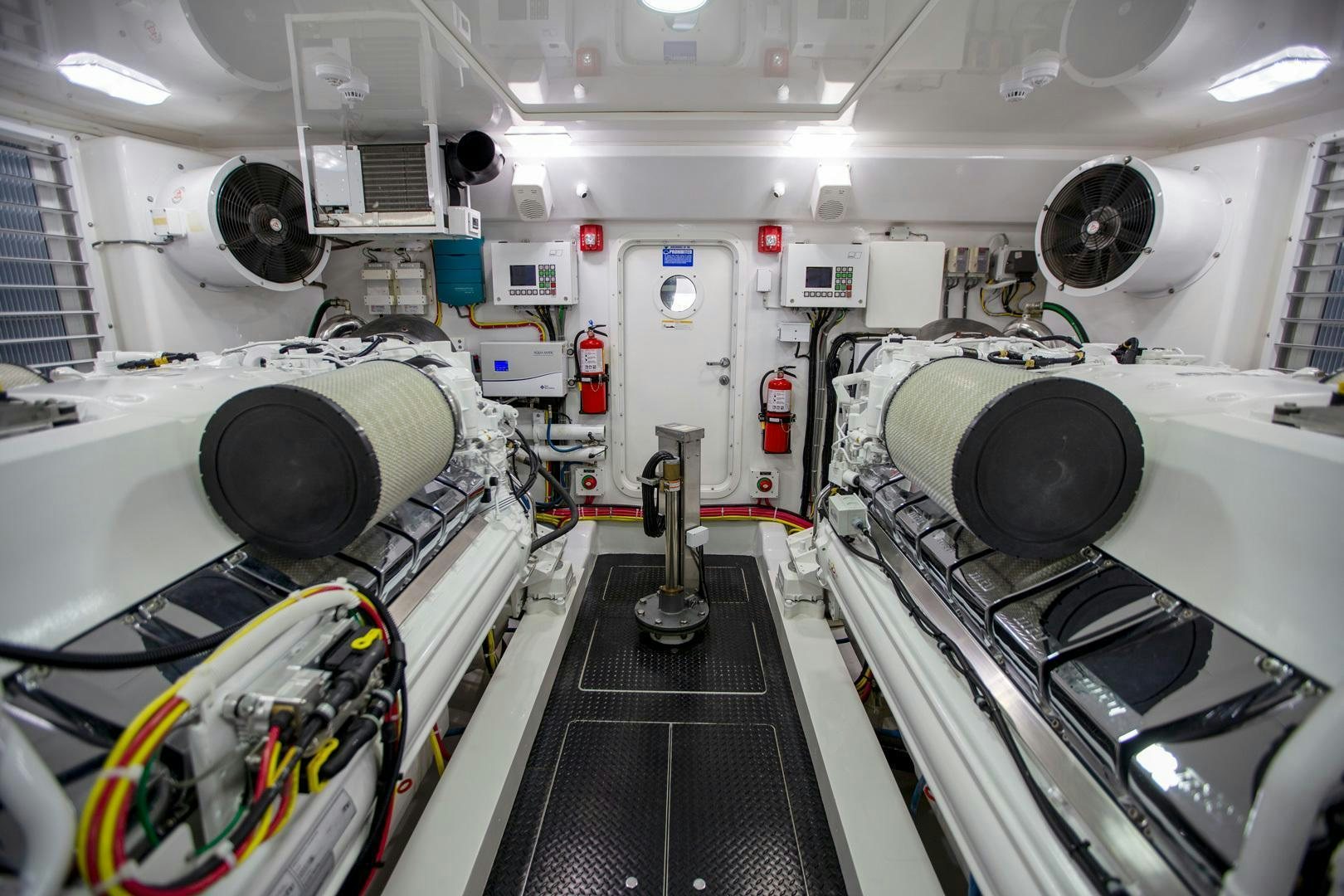 a room with large speakers and a row of speakers aboard REEL HIGH'S Yacht for Sale