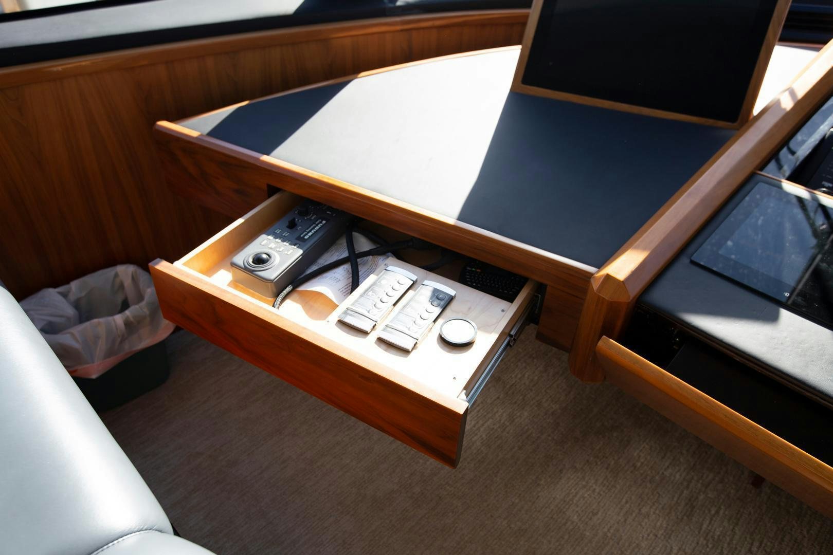a table with a remote control aboard REEL HIGH'S Yacht for Sale