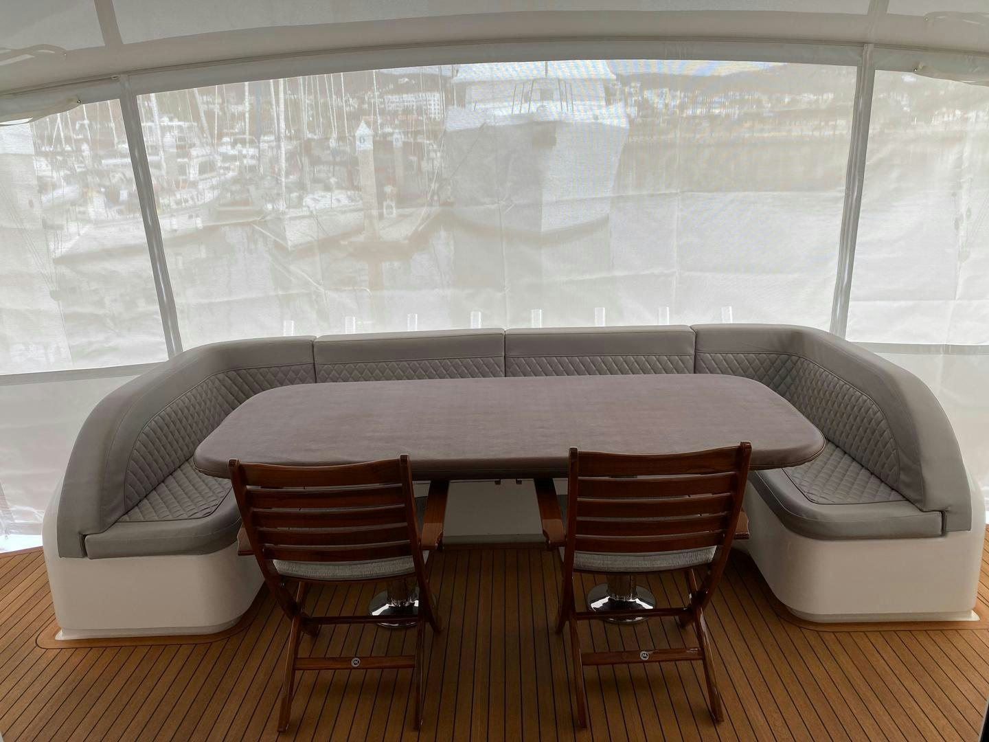 a table and chairs in a room aboard REEL HIGH'S Yacht for Sale