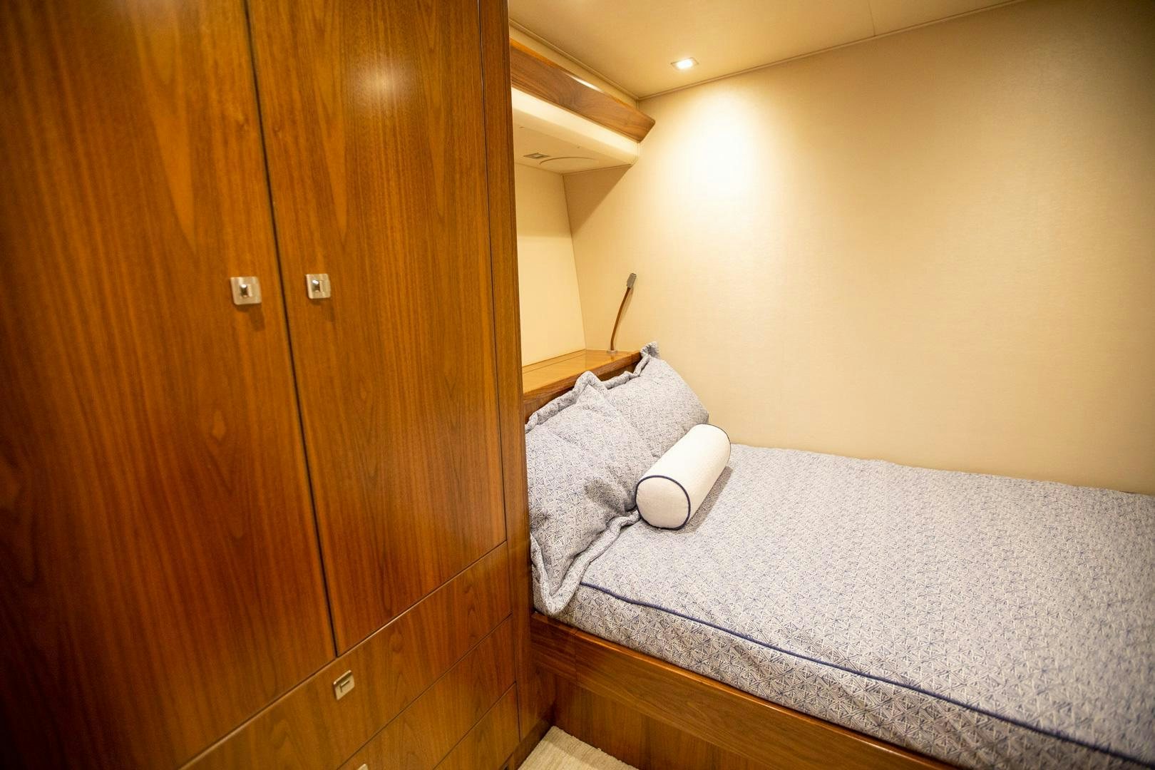 a bed in a room aboard REEL HIGH'S Yacht for Sale