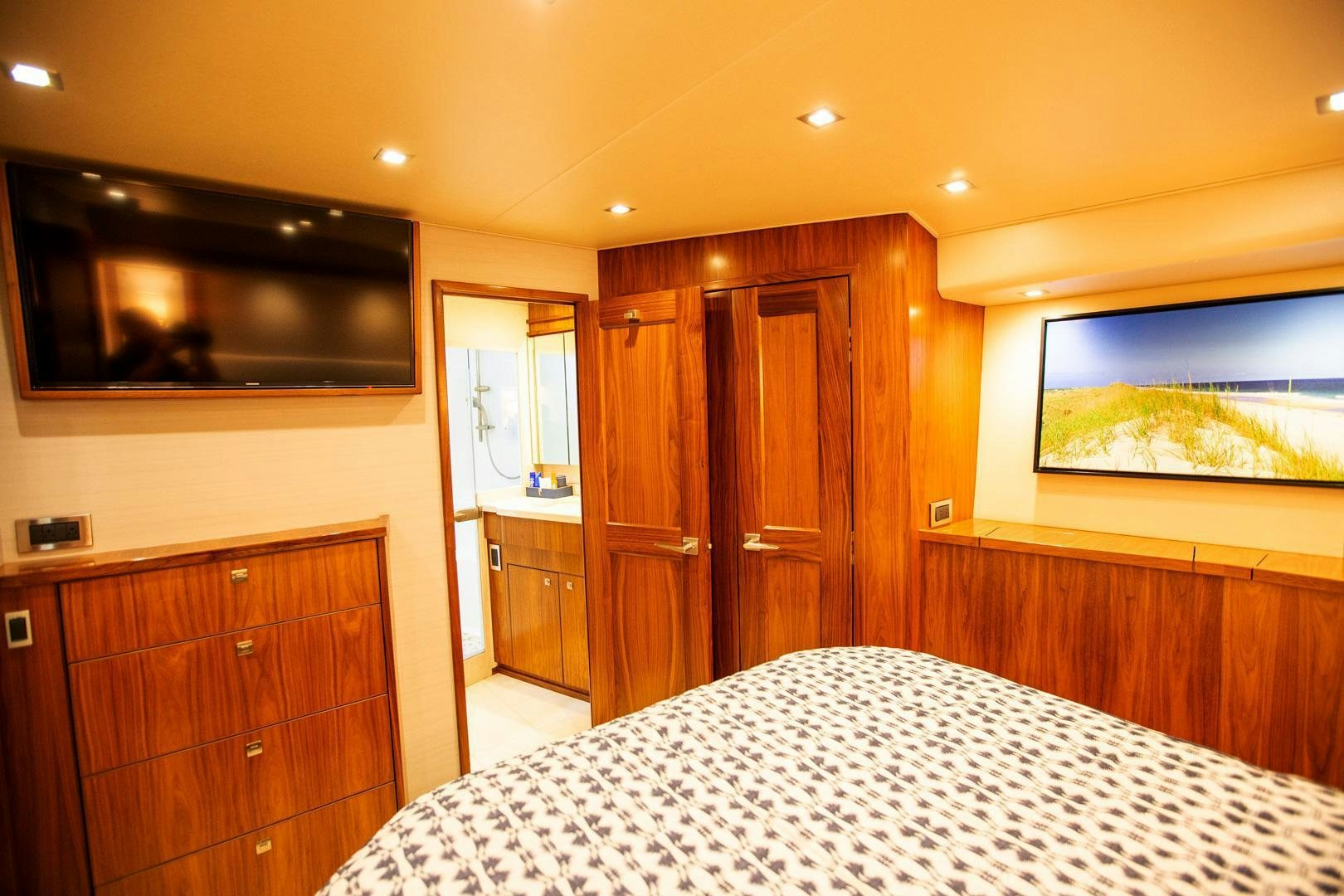a bedroom with a large bed aboard REEL HIGH'S Yacht for Sale