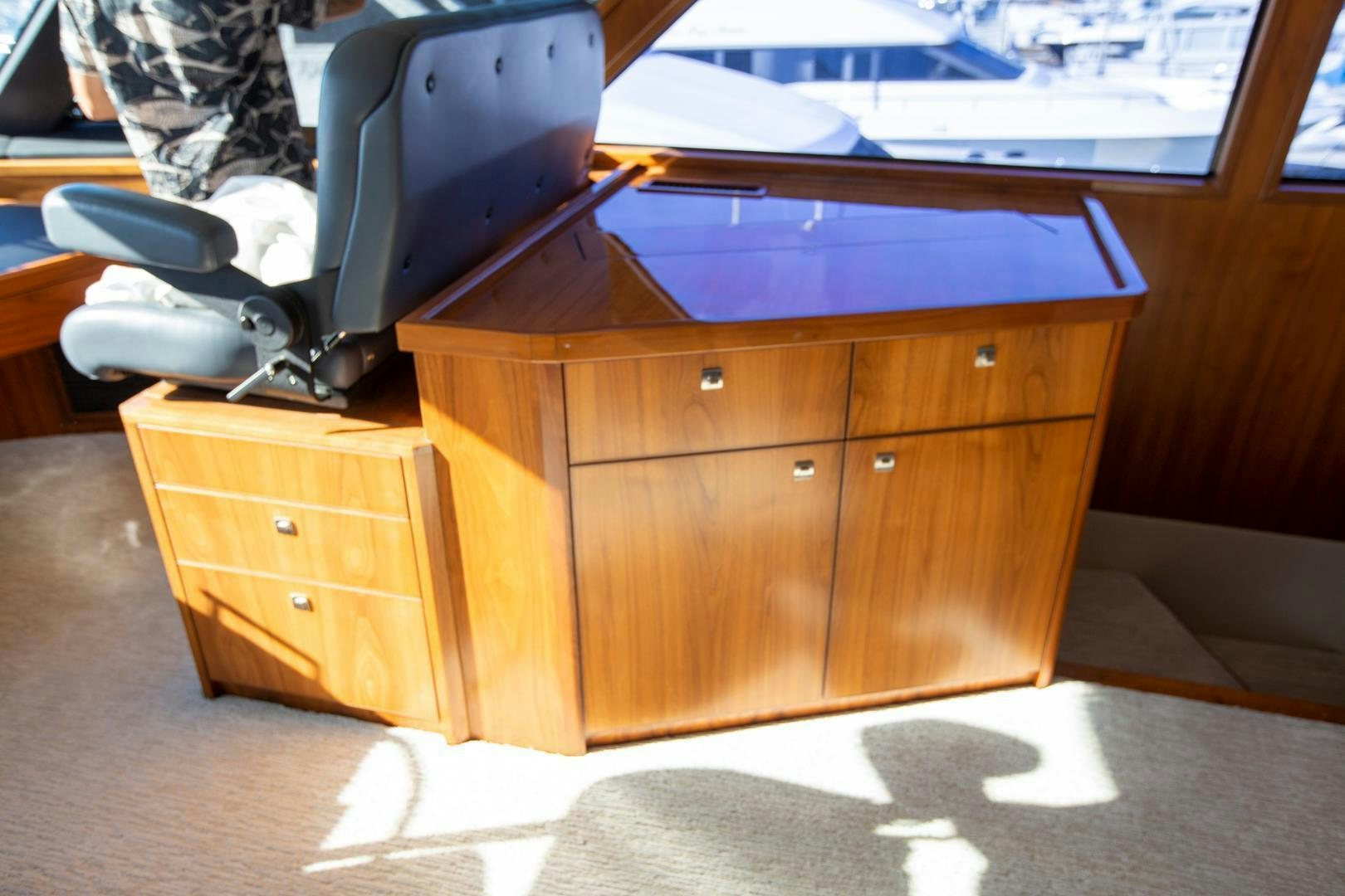 a desk with a computer on it aboard REEL HIGH'S Yacht for Sale