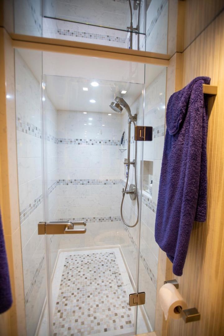 a shower with a towel on the wall aboard REEL HIGH'S Yacht for Sale