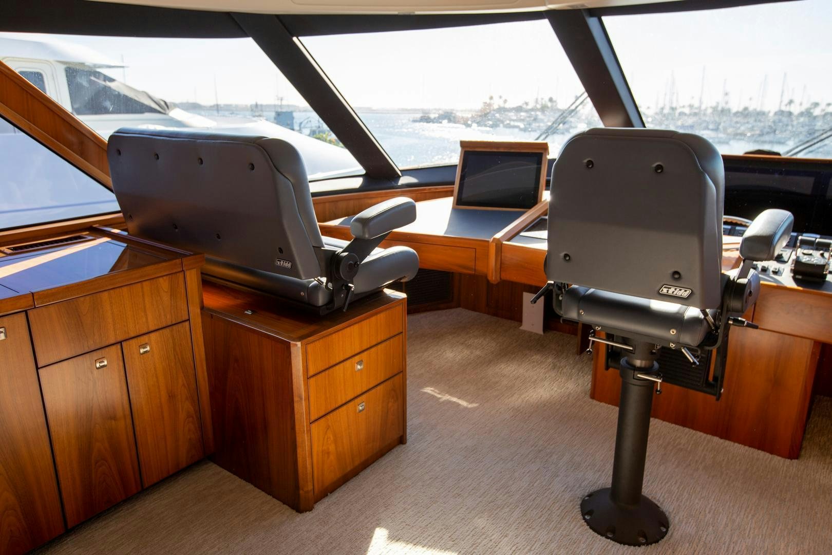 a room with a large window and a desk with a computer on it aboard REEL HIGH'S Yacht for Sale