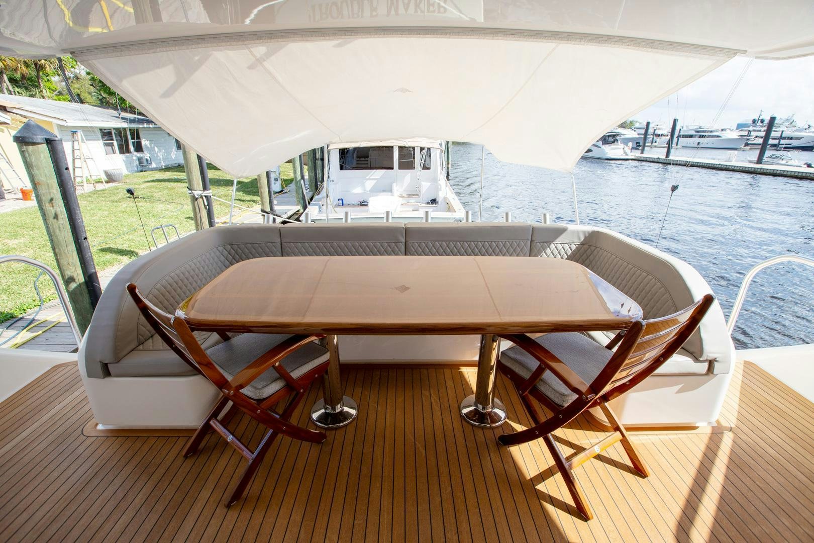 a table on a deck aboard REEL HIGH'S Yacht for Sale