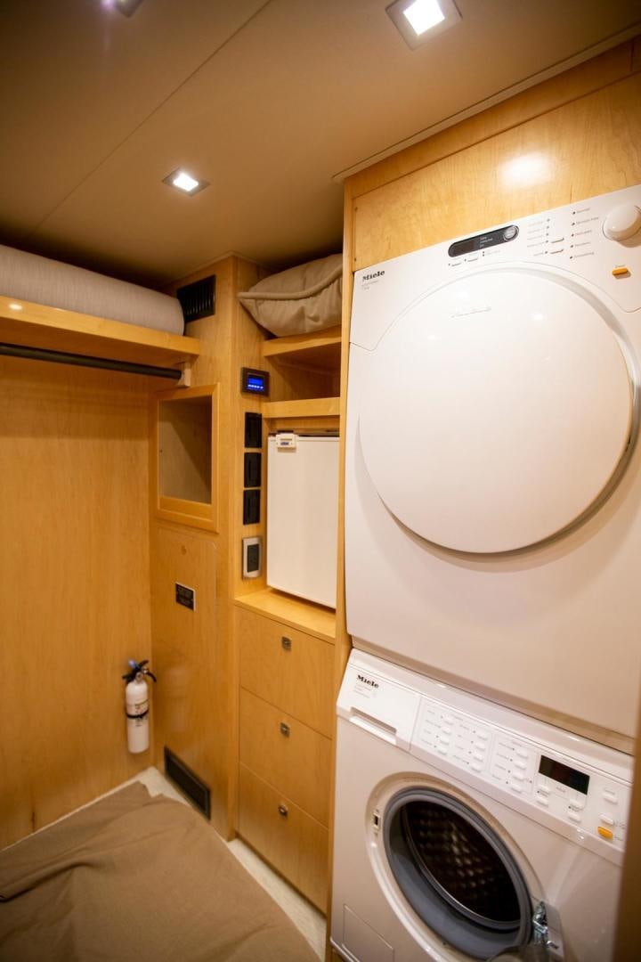 a washing machine in a room aboard REEL HIGH'S Yacht for Sale