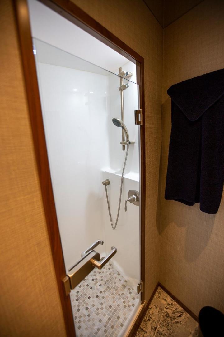 a shower with a towel on the wall aboard REEL HIGH'S Yacht for Sale
