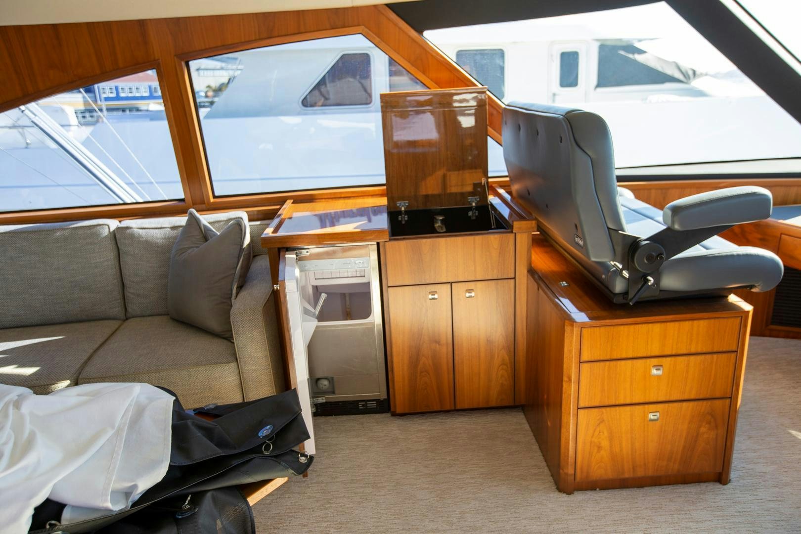 a room with a couch and a desk aboard REEL HIGH'S Yacht for Sale