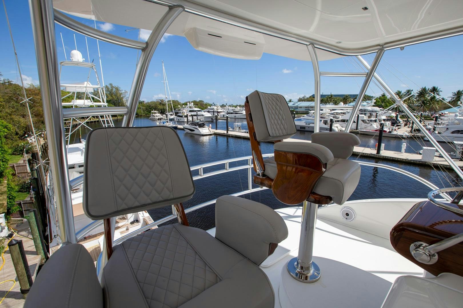 a boat with a chair and a table on it aboard REEL HIGH'S Yacht for Sale