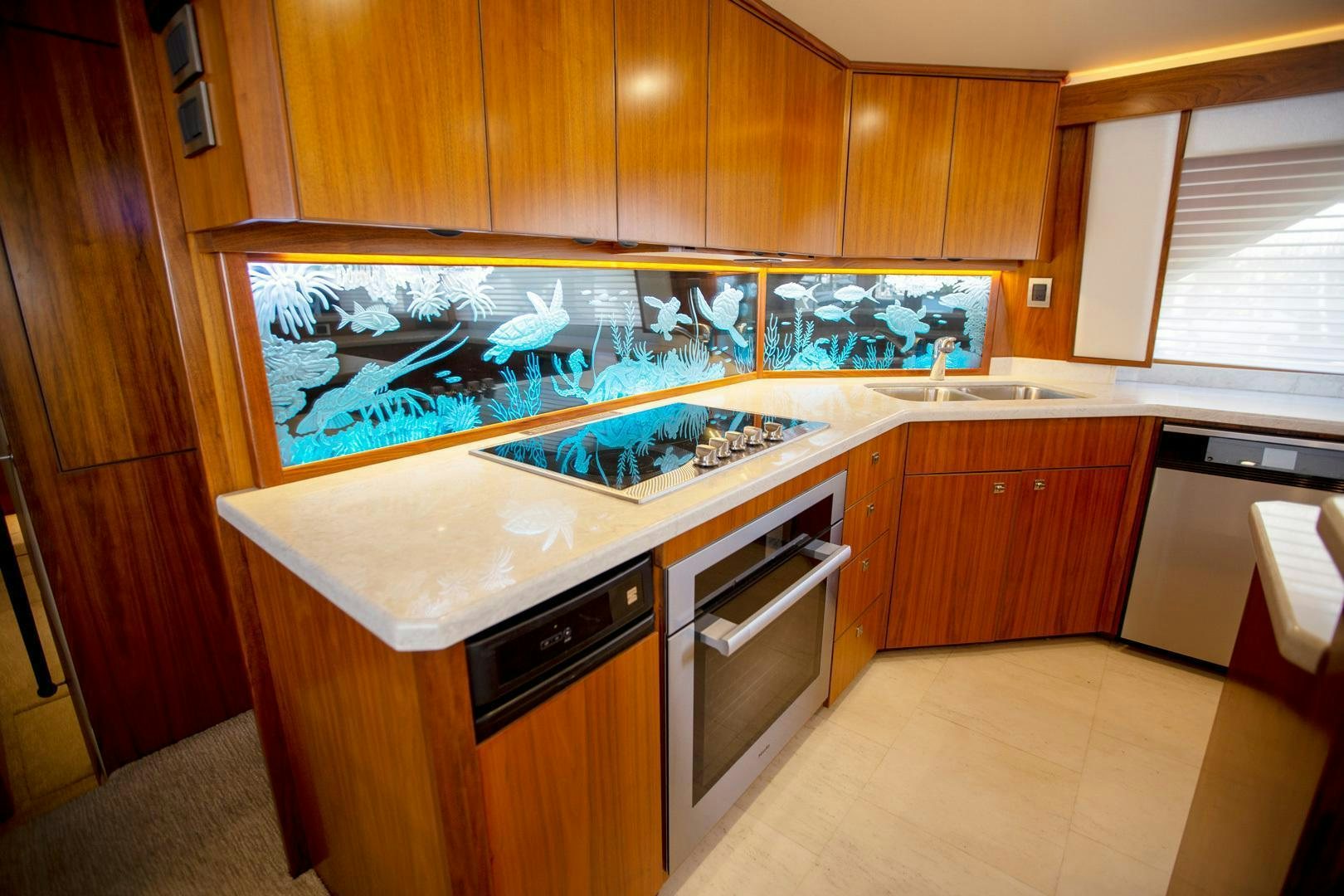 a kitchen with a large fish tank aboard REEL HIGH'S Yacht for Sale