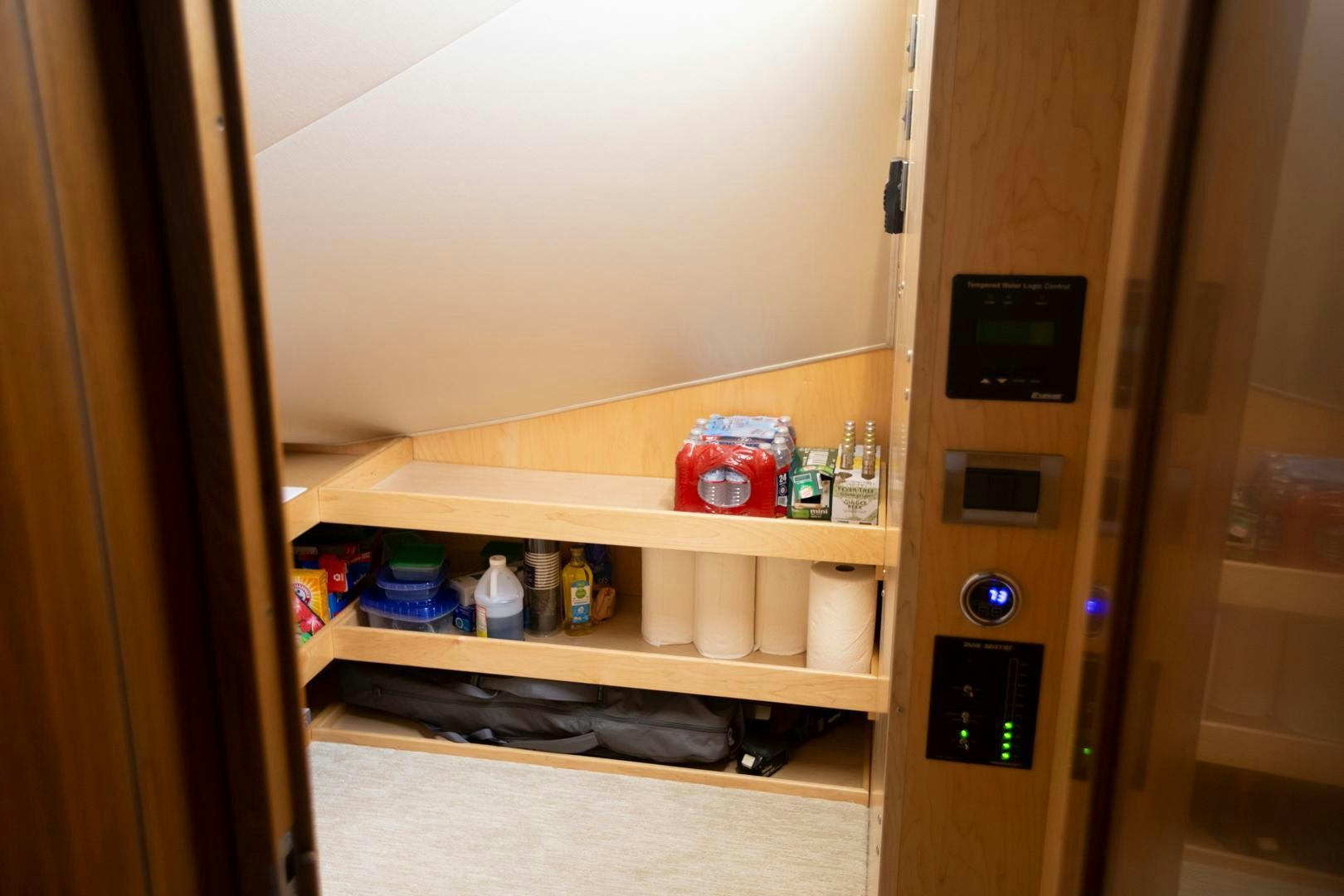 a cabinet with a shelf of items on it aboard REEL HIGH'S Yacht for Sale