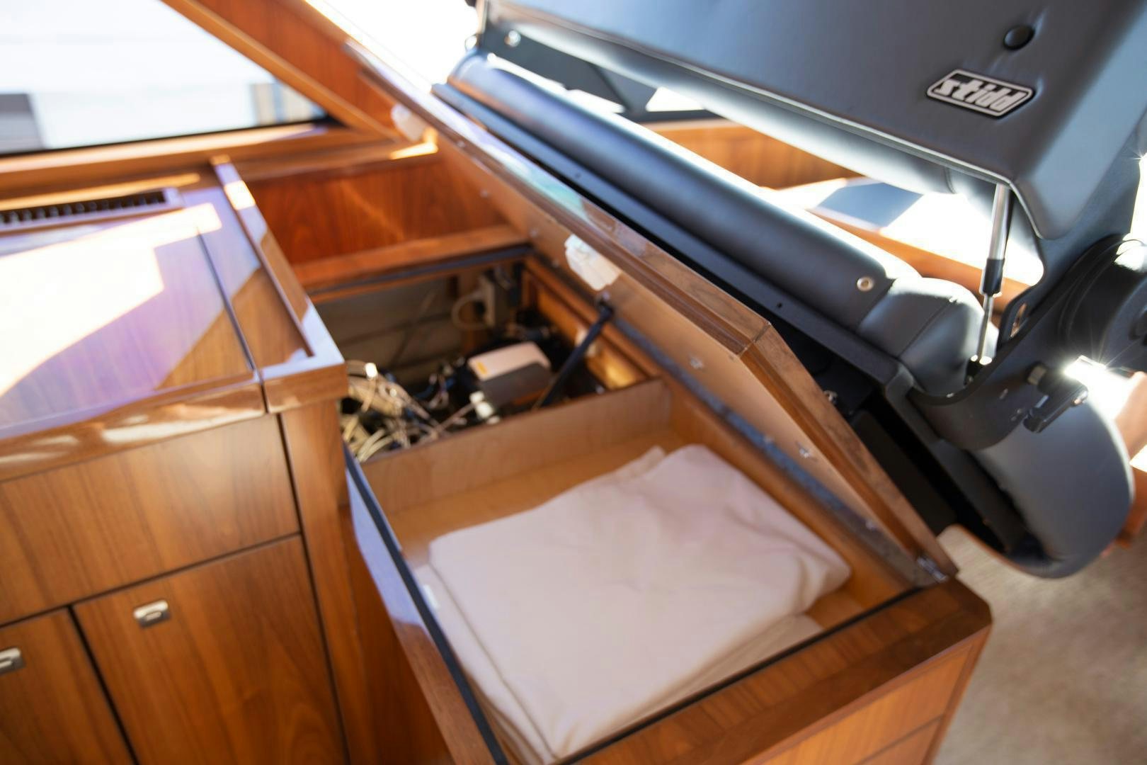 a car with a seat aboard REEL HIGH'S Yacht for Sale