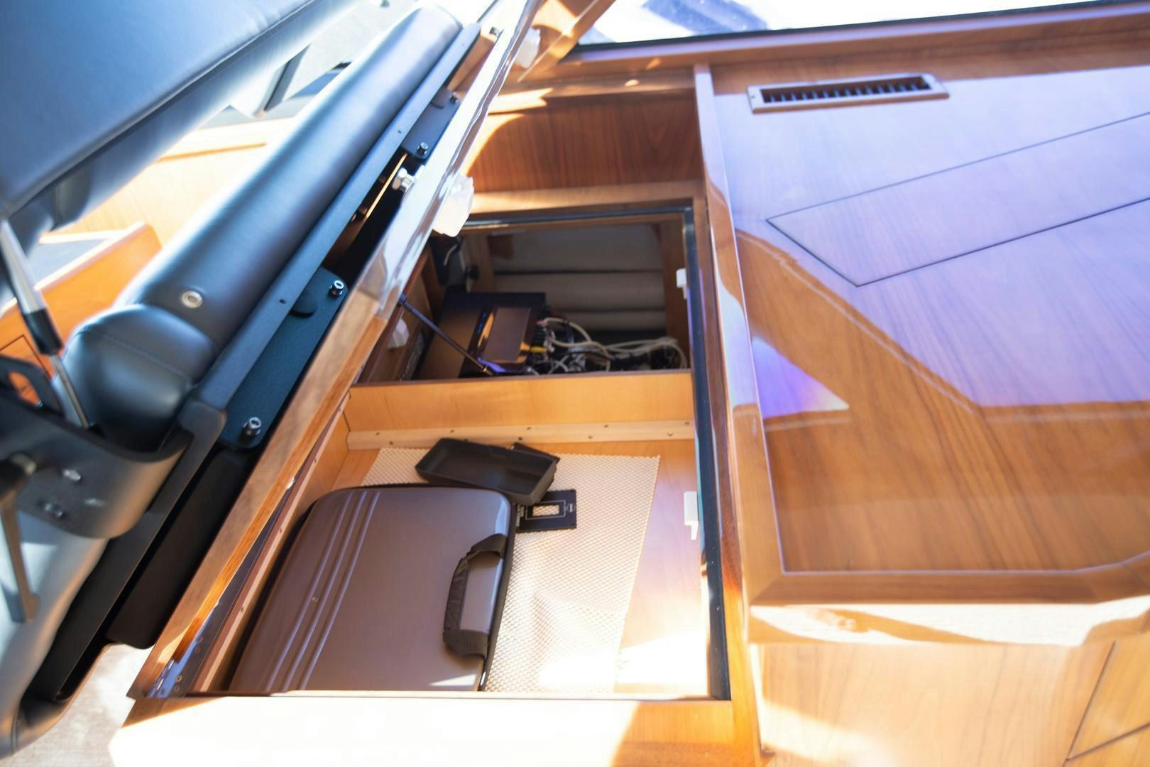 a desk with a laptop and a chair aboard REEL HIGH'S Yacht for Sale