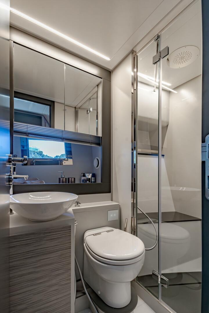 a bathroom with a glass shower aboard SILVER MISSILE Yacht for Sale