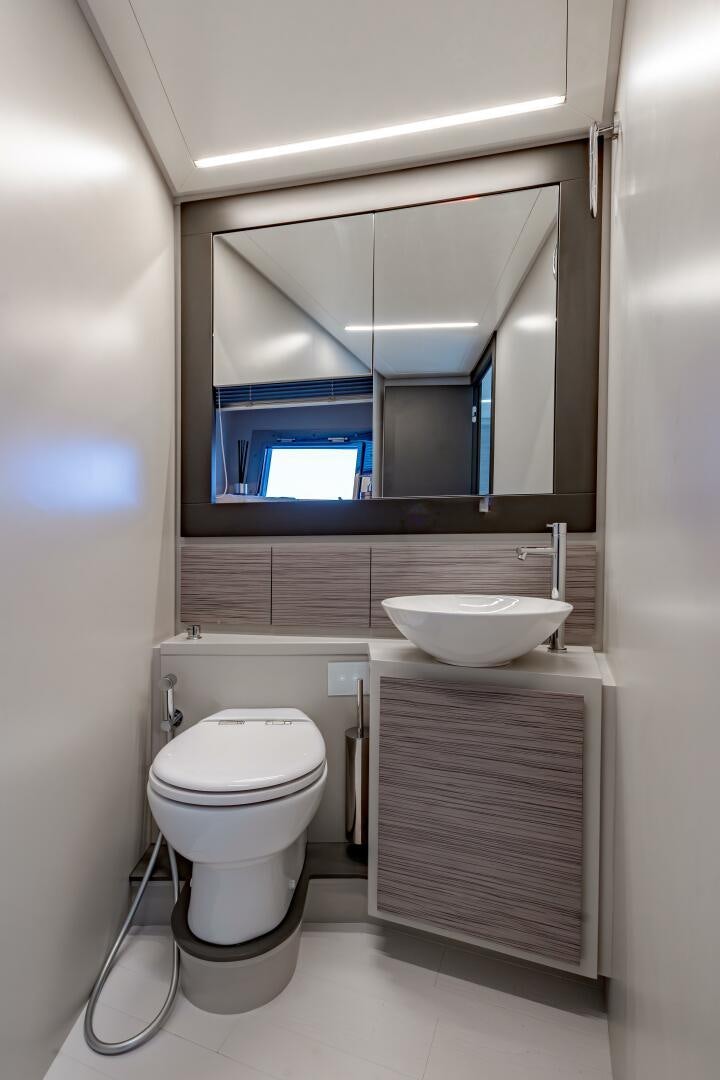 a bathroom with a sink and a toilet aboard SILVER MISSILE Yacht for Sale