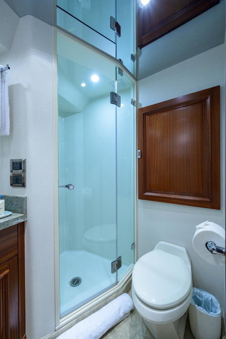 a bathroom with a shower and toilet aboard CERCA TROVA Yacht for Sale