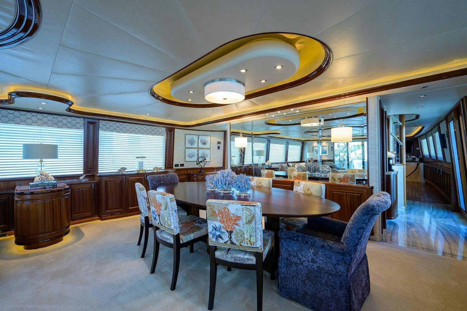 a large room with a table and chairs aboard CERCA TROVA Yacht for Sale